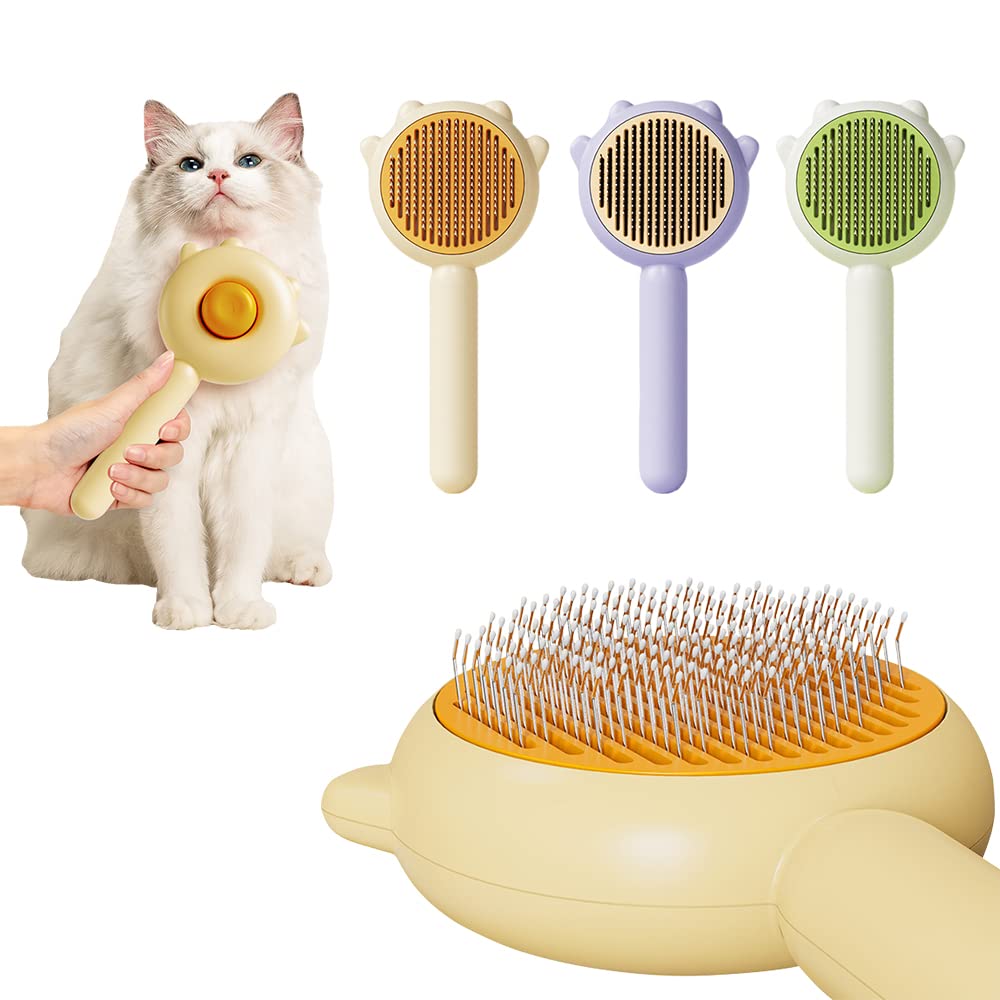 Self-cleaning slicker brush in green, purple, and yellow with a cat